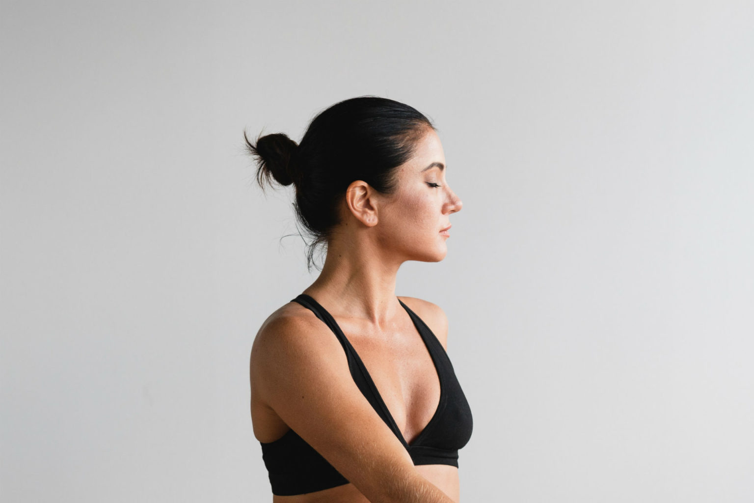 woman stretching on a yoga mat