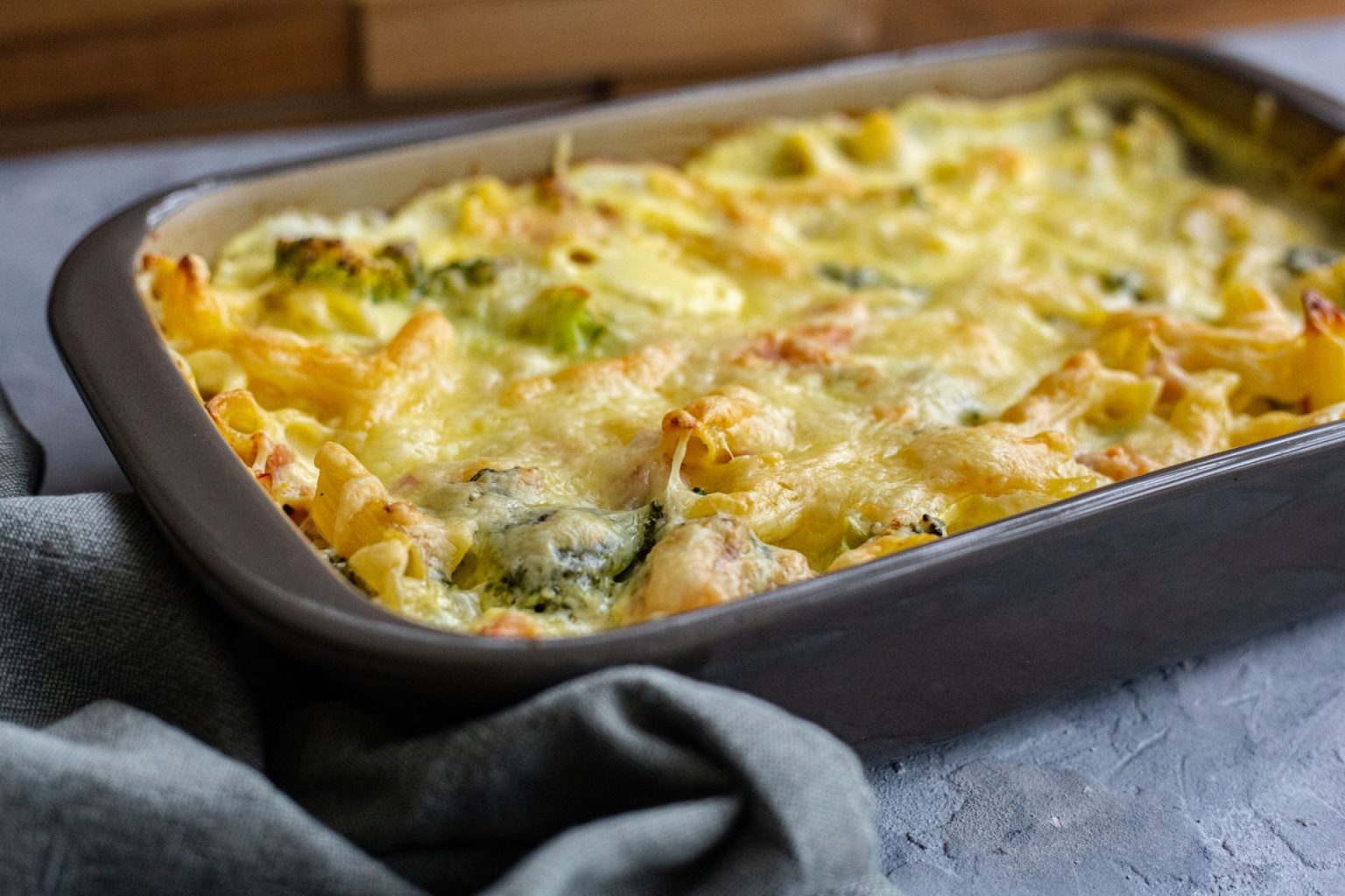 Mac and cheese with bacon and chard in a casserole dish