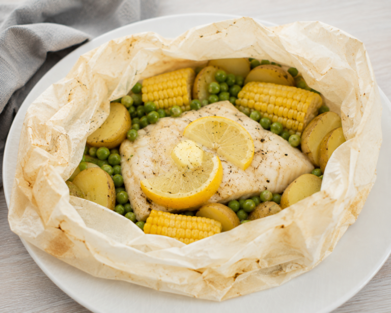 Sole, potato and veggie packets open after cooking