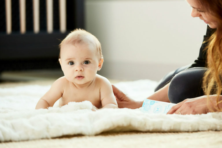 baby having tummy time on the carpet