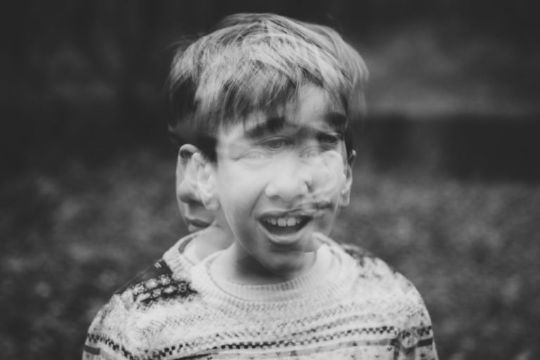 child shaking head violently