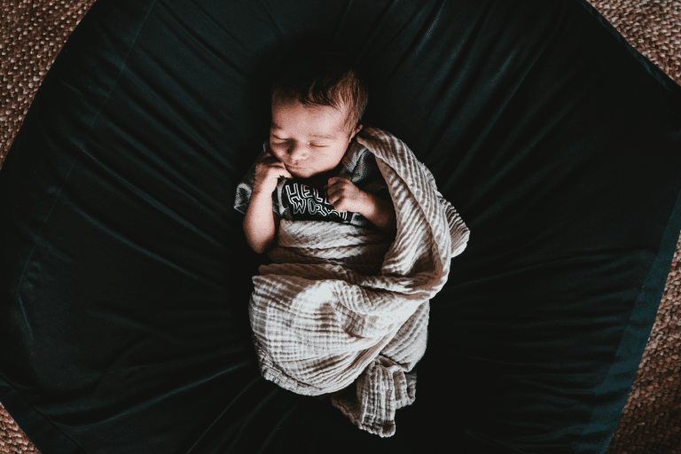 baby sleeping in a blanket