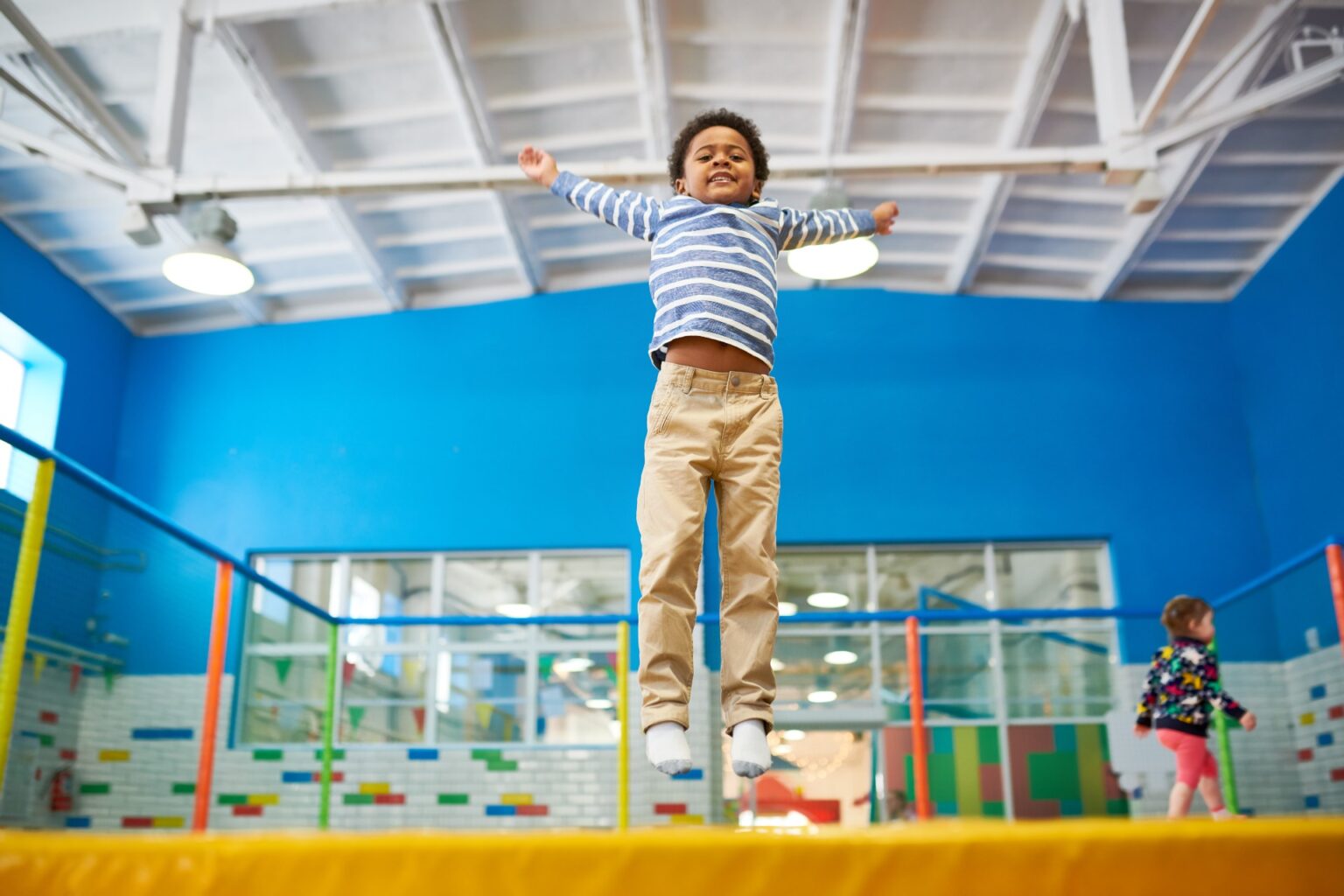 child jumping on the trampoline