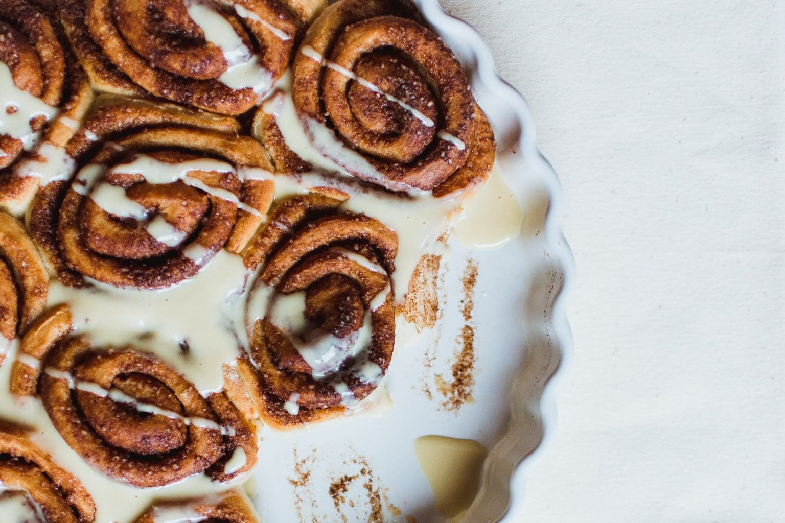 plate of cinnamon buns with a vanilla glaze