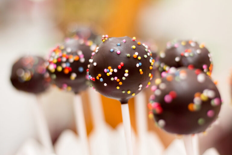 a group of chocolate cake pops with sprinkles