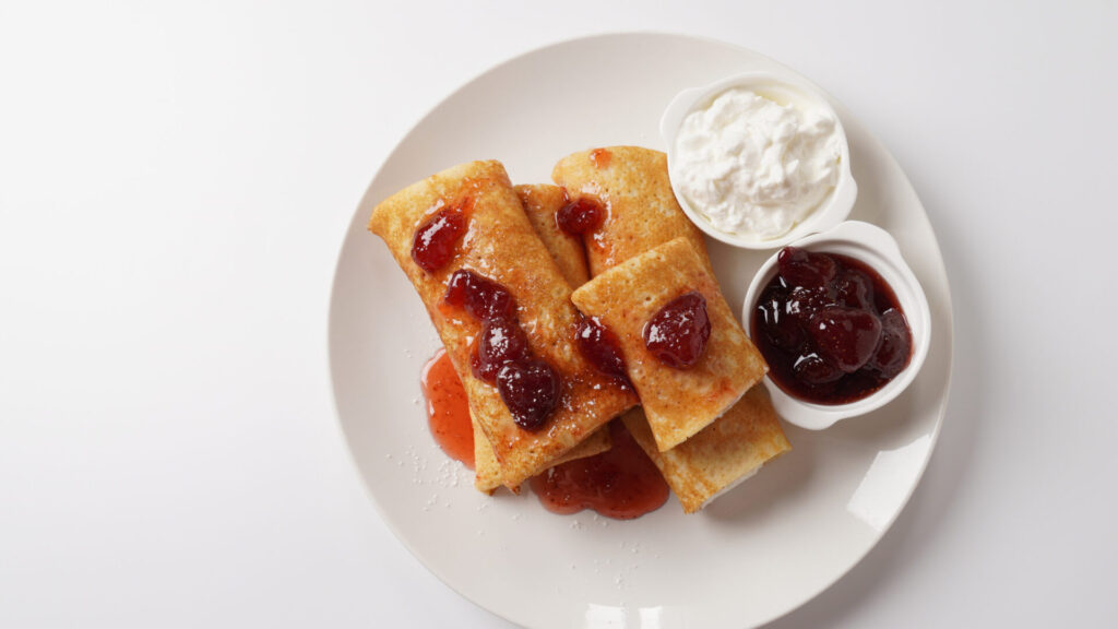 Cherry cheese blintzes with cherry compote and two dipping sauces