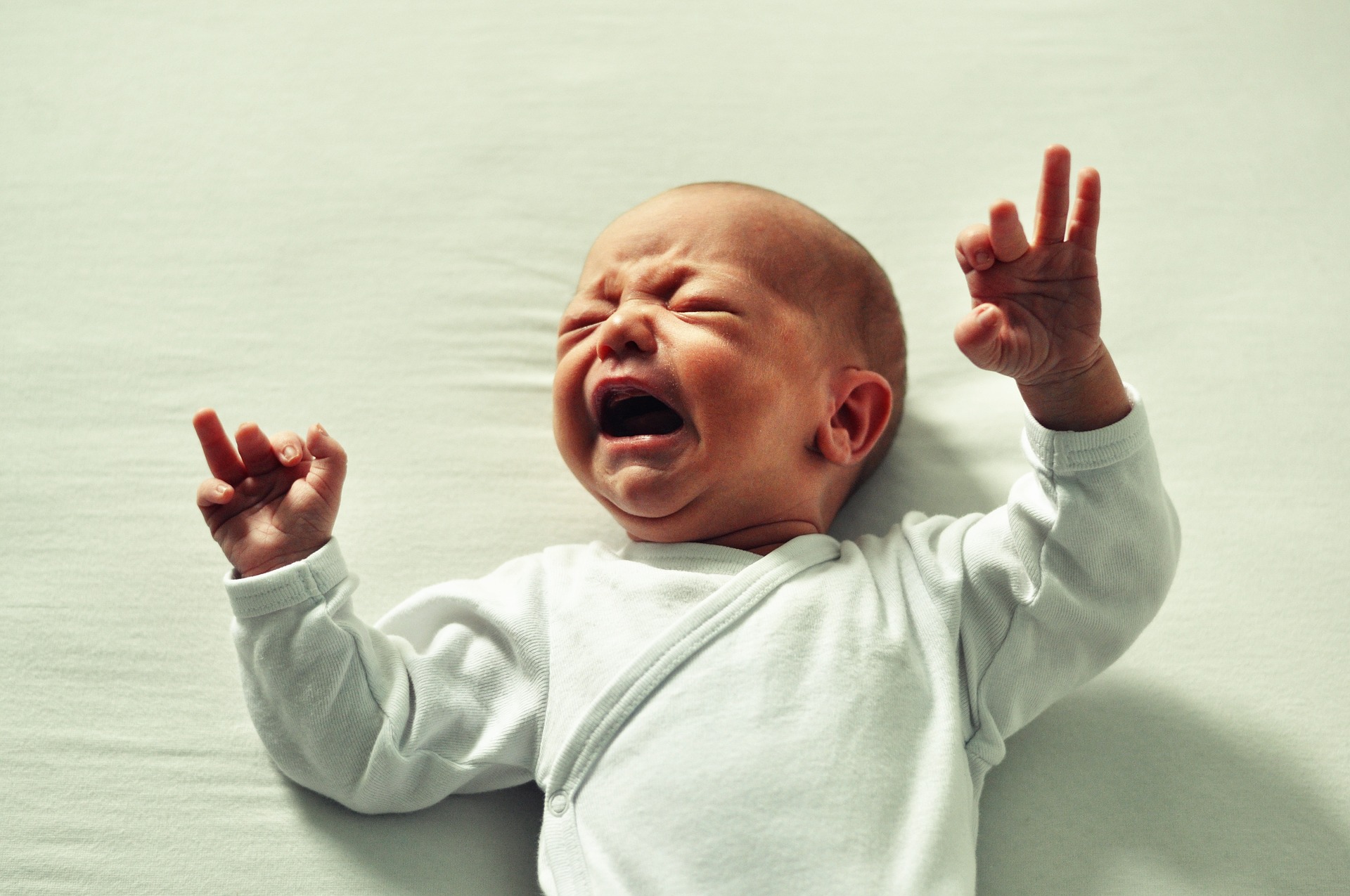 baby crying in a crib