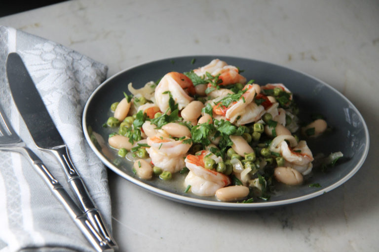 plate of shrimp, greens and beans