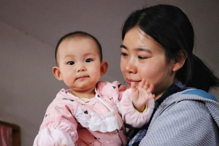 mother holding her baby