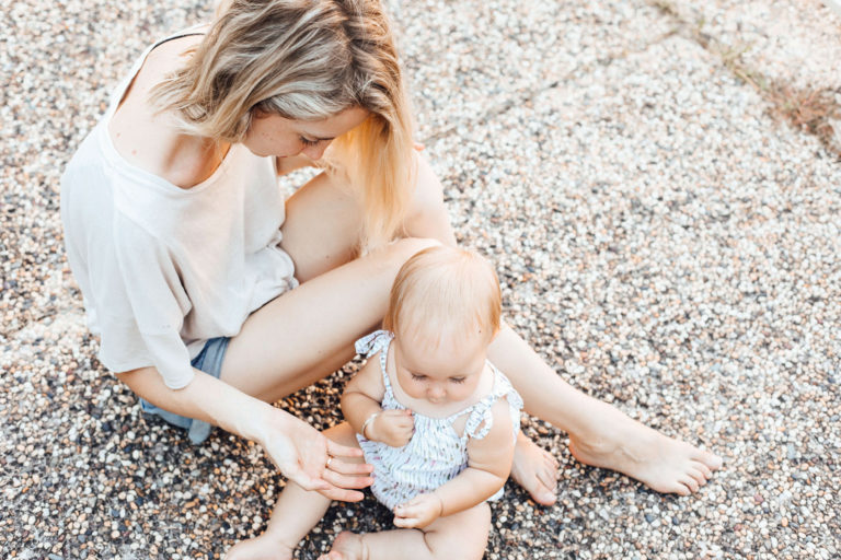 mother and baby on the ground