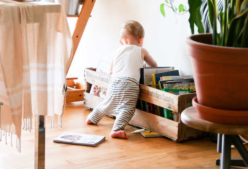 how to help baby stand on their own