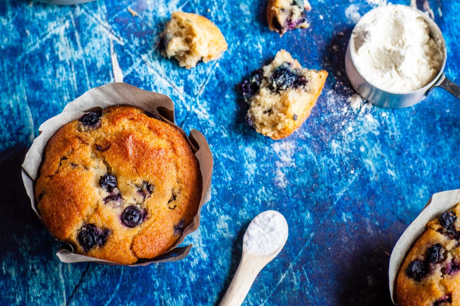 blueberry muffins on a blue background