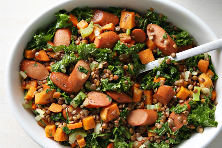 bowl of kale, veggies, sweet potato and hot dogs