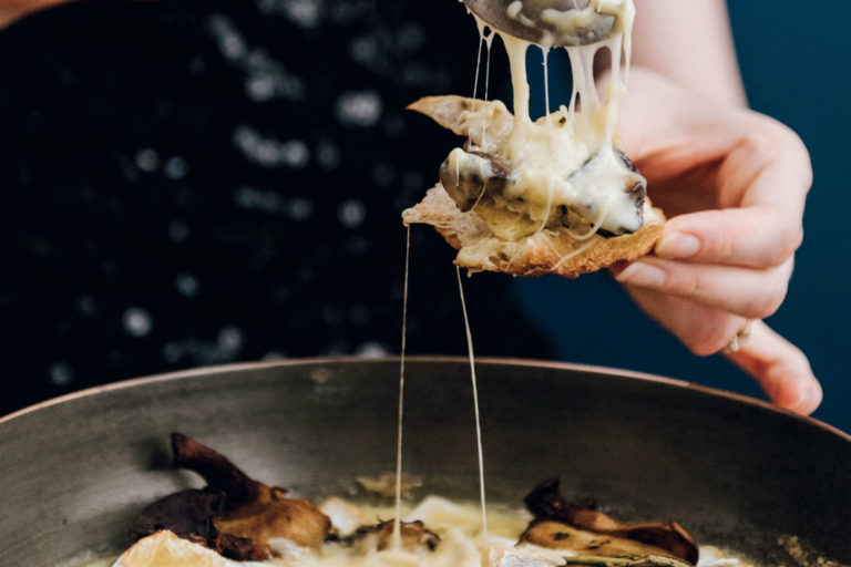 melted cheese and mushroom on a crusty piece of bread