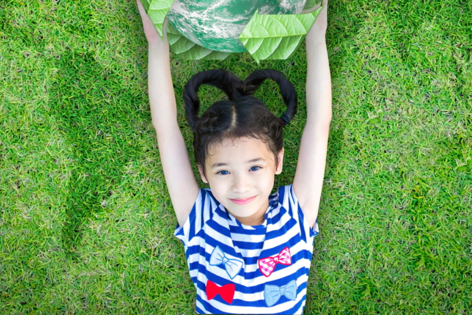 Girl holding globe