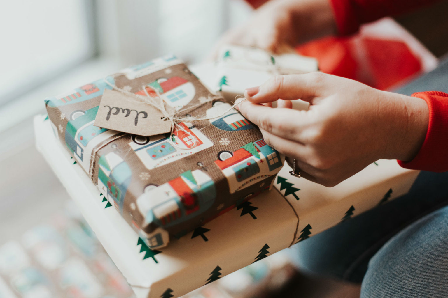 hand holding wrapped christmas presents