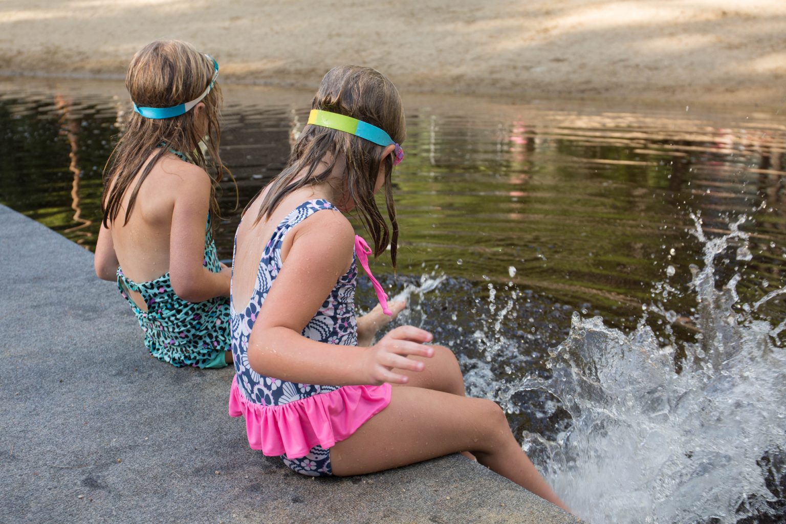 Girls splashing each other in the water