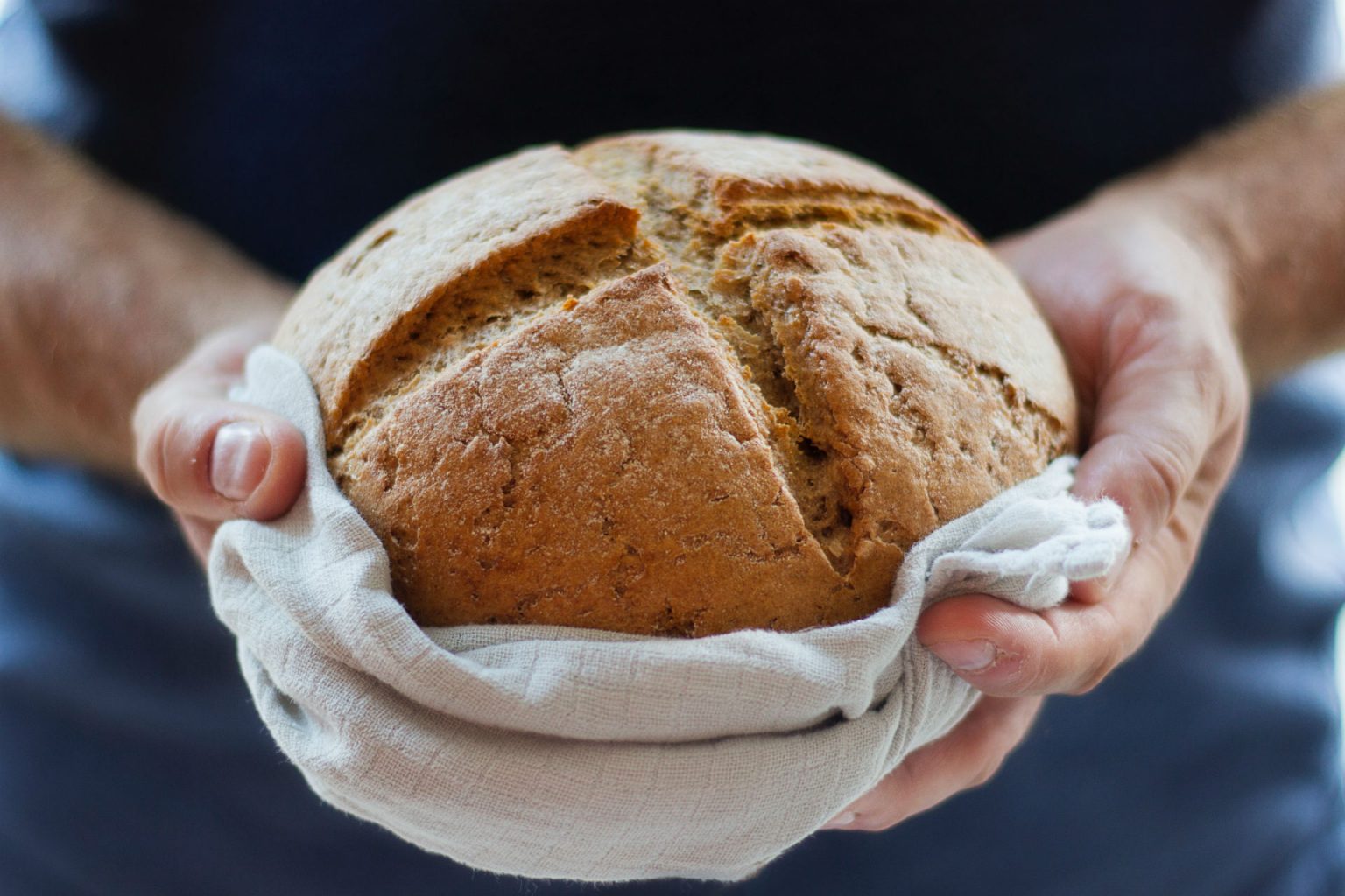 soda bread wrapped in a tea towel