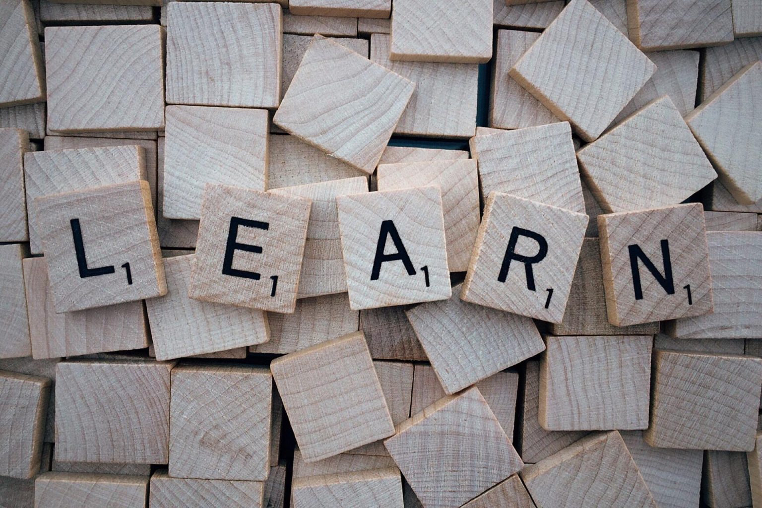 Scrabble tiles spelling out the word LEARN