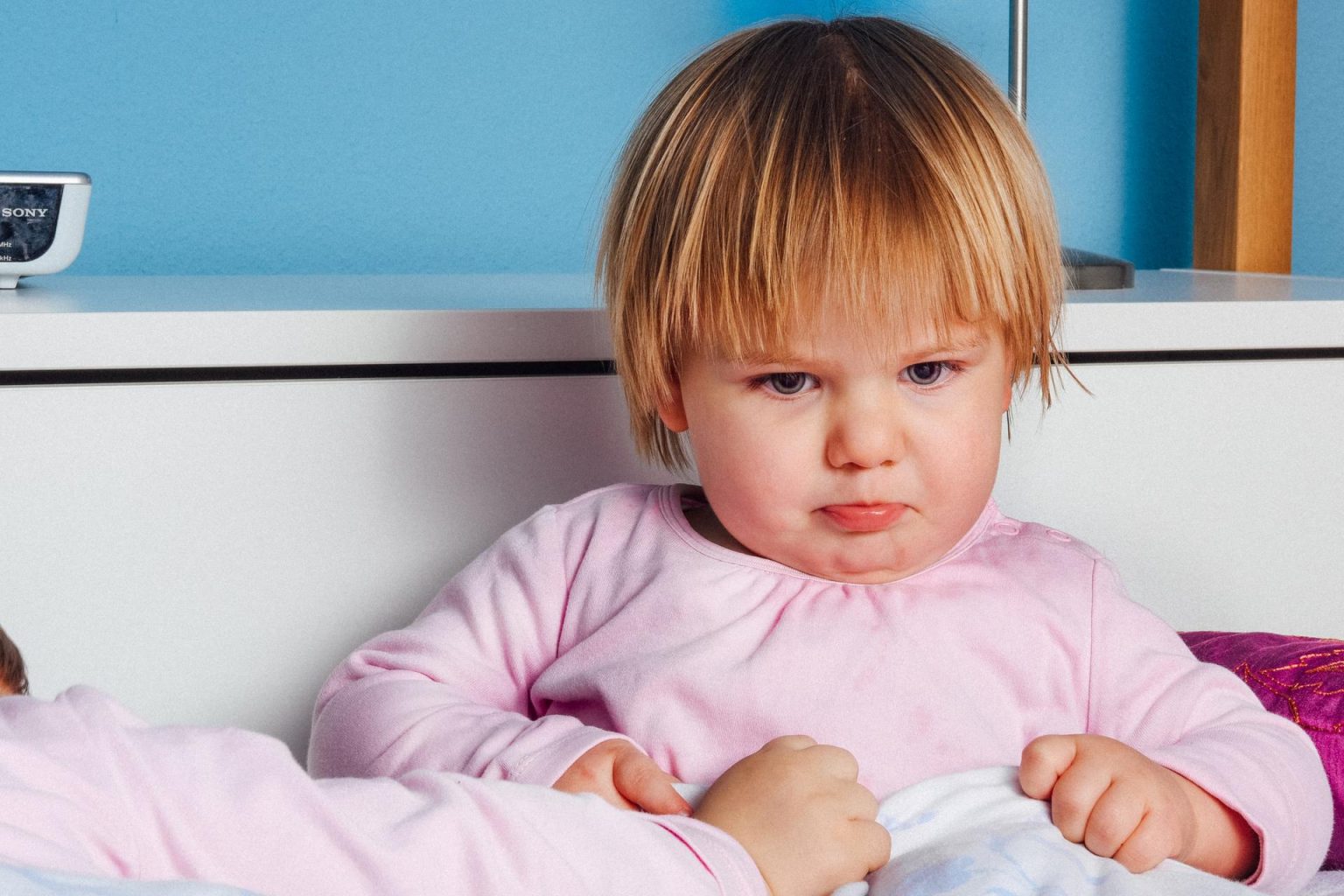 Toddler looking sadly at the camera