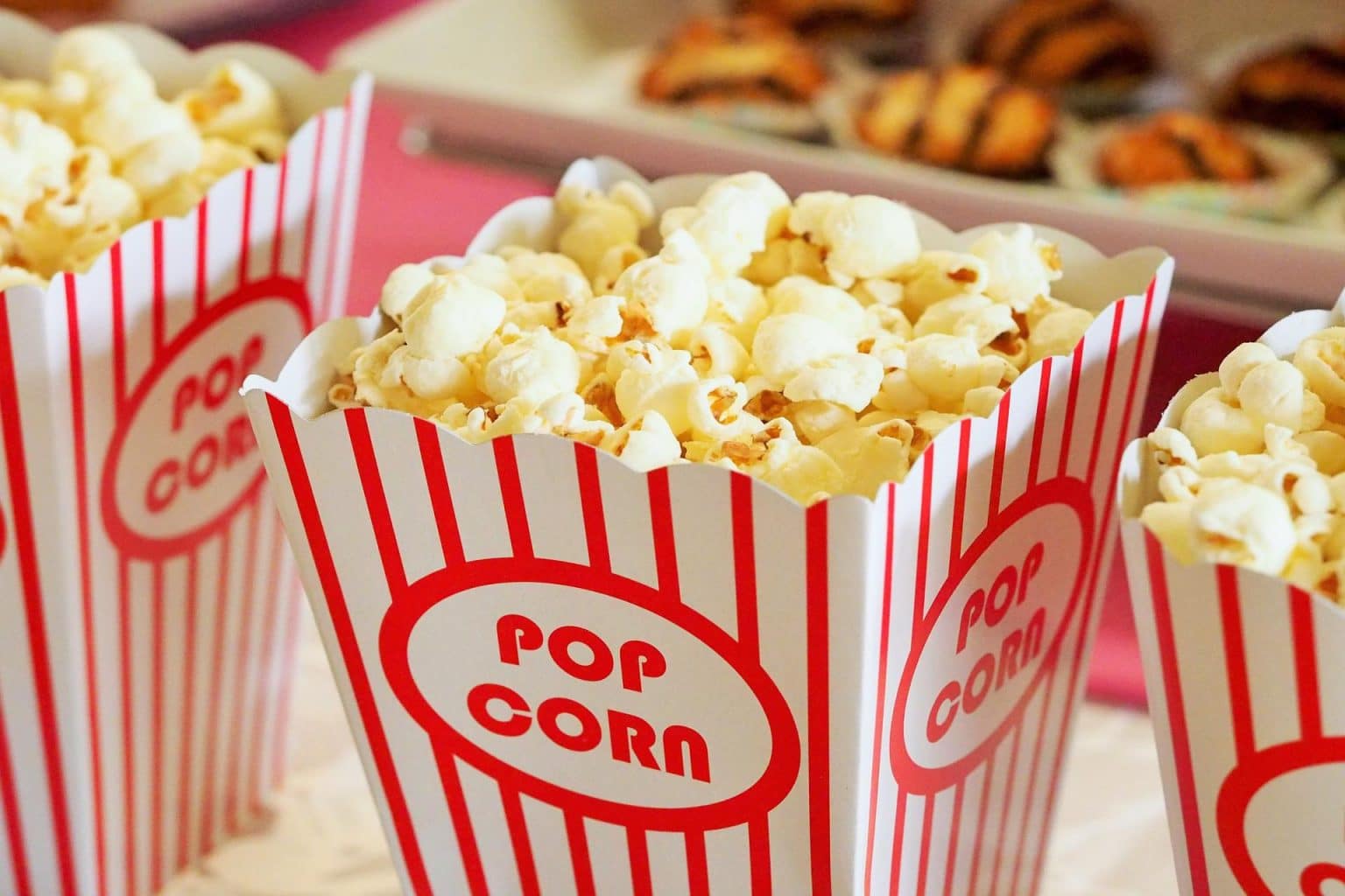 Popcorn in red and white movie theatre boxes