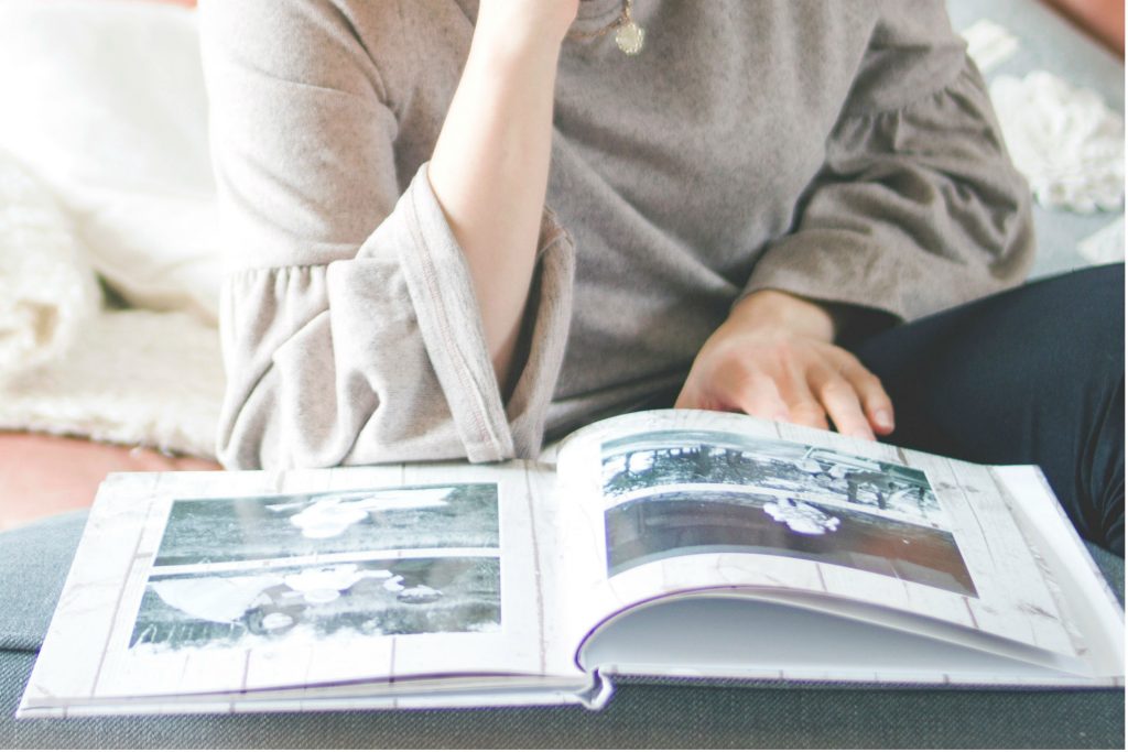 woman flipping through a photo album