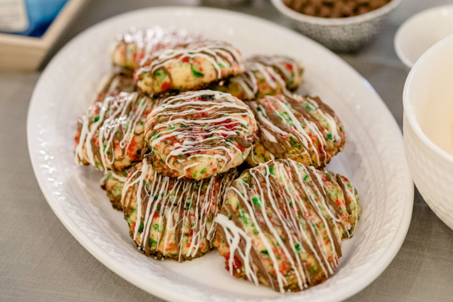 plate of cookies drizzled with chocolate