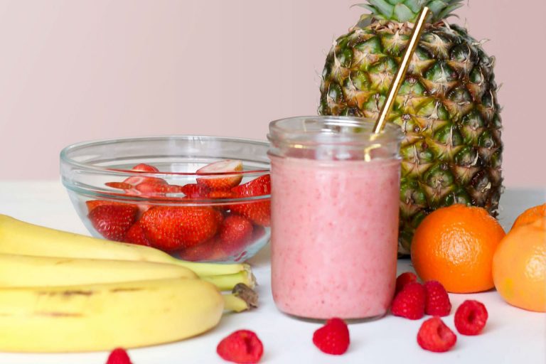 smoothie with fruit on a counter