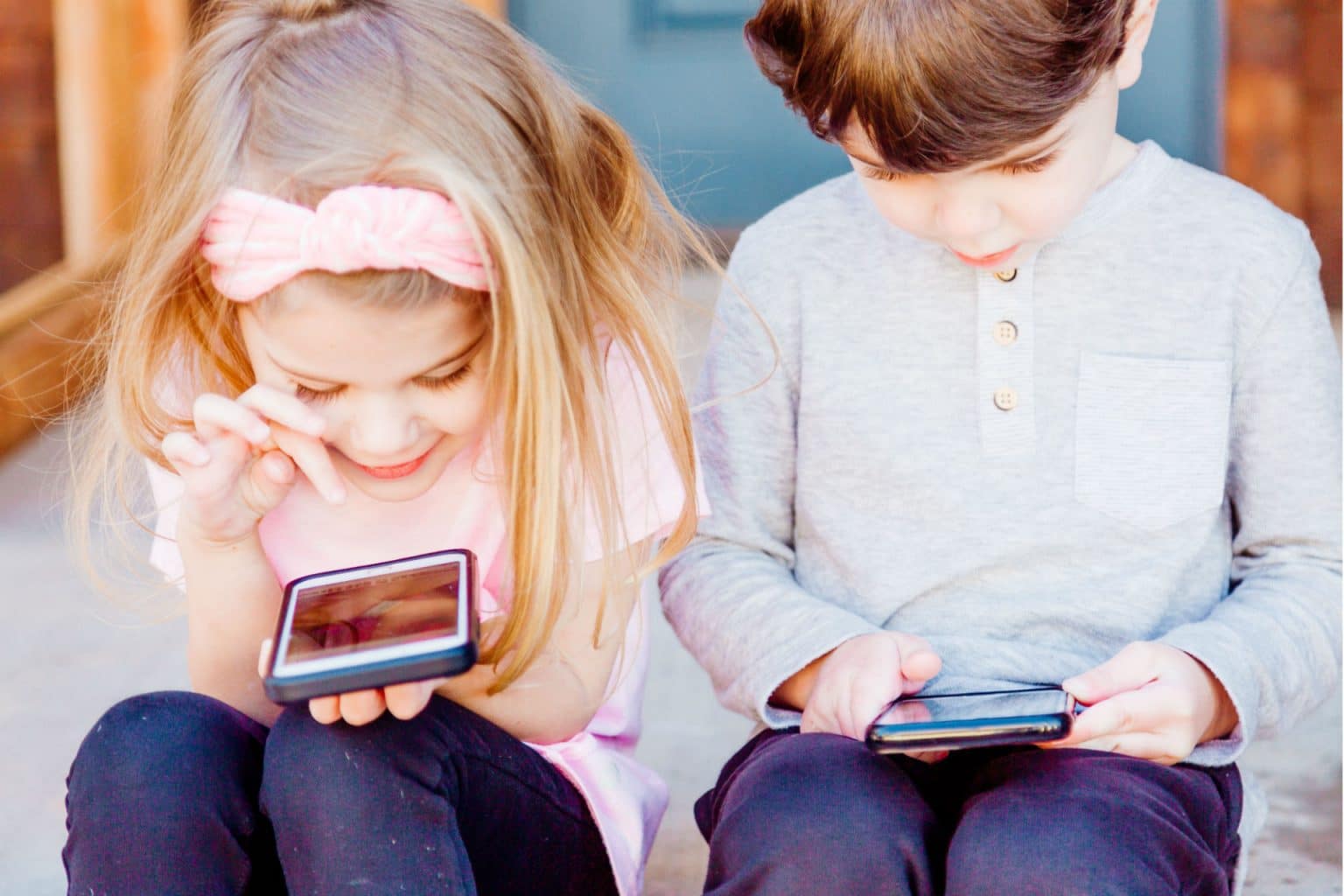 Two kids on a tablet