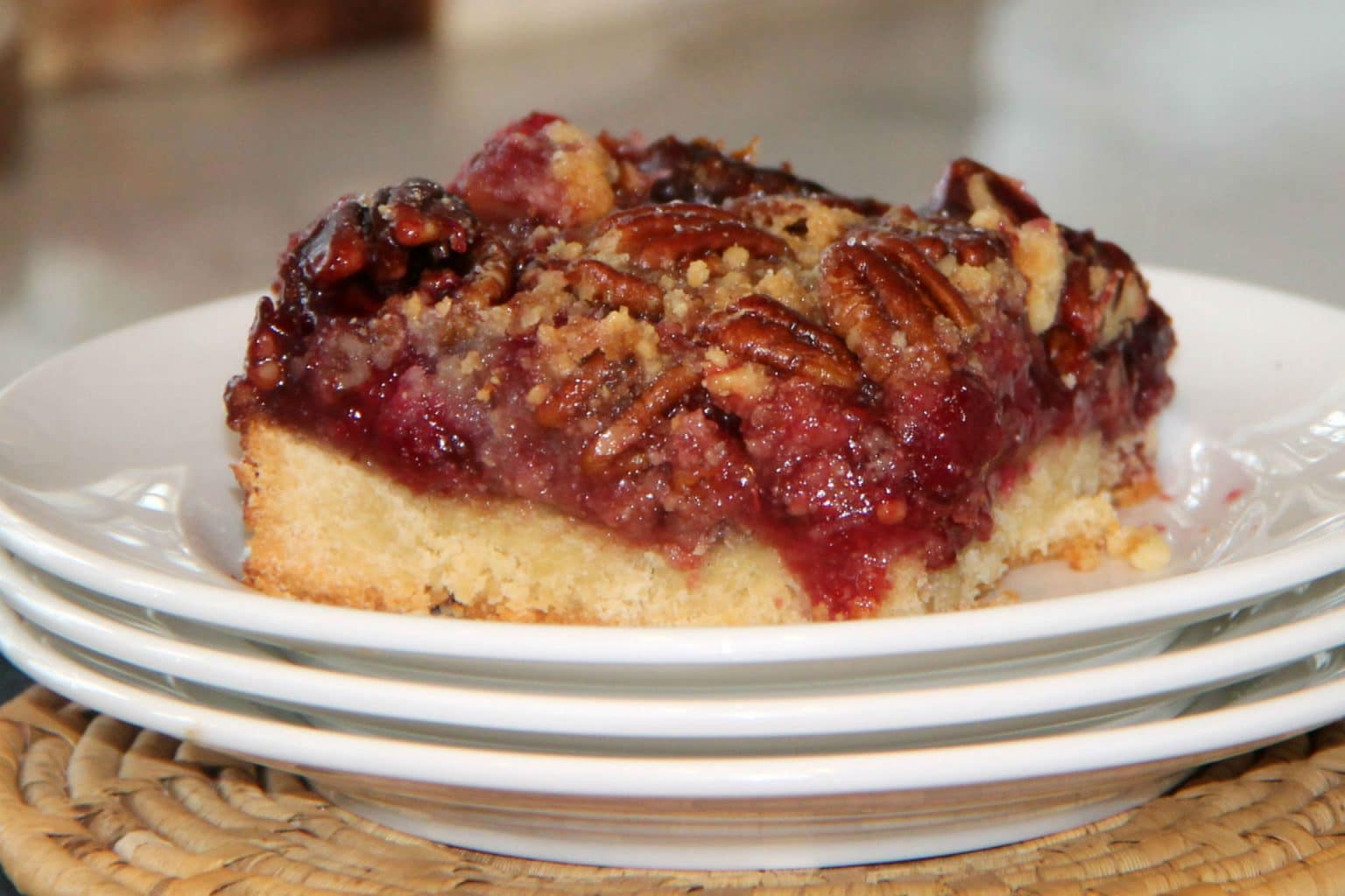 raspberry and pecan tart on a plate