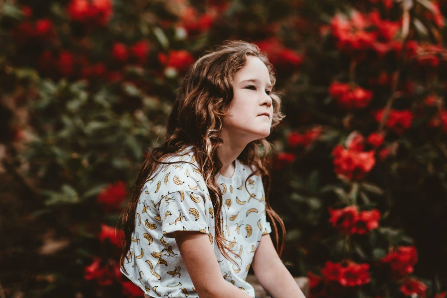 girl sitting and looking into the distance