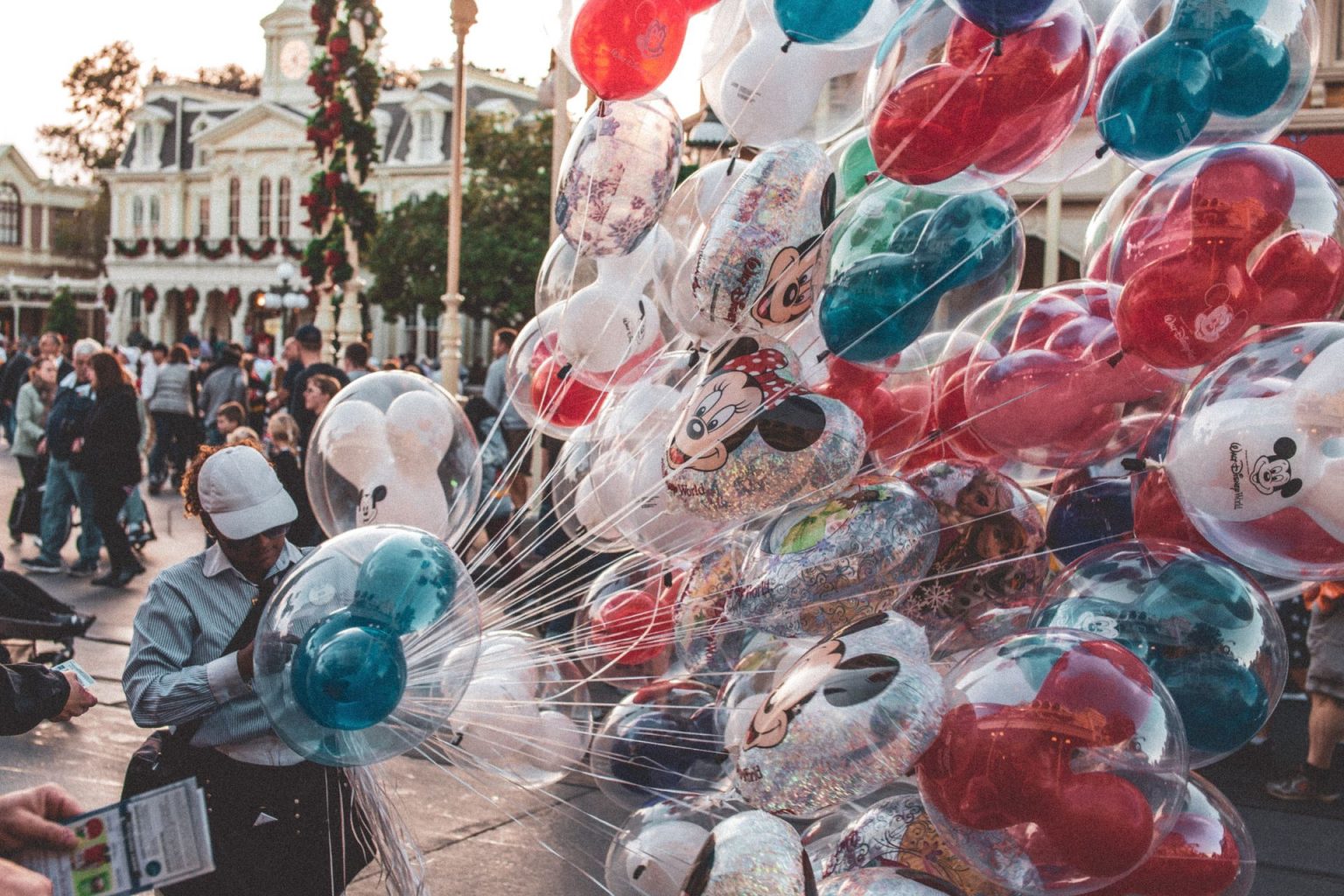 Disneyworld staff person with Mickey Mouse balloons