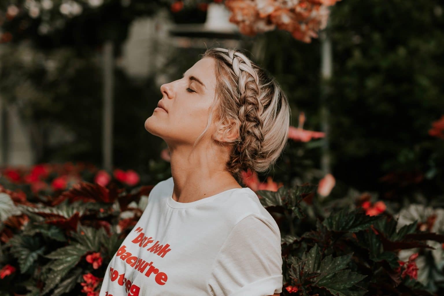 woman holding head up and breathing