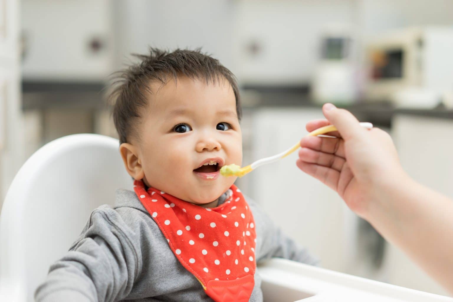 Baby eating baby food