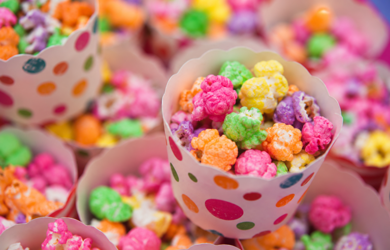 Multicoloured popcorn in paper polka dotted cups