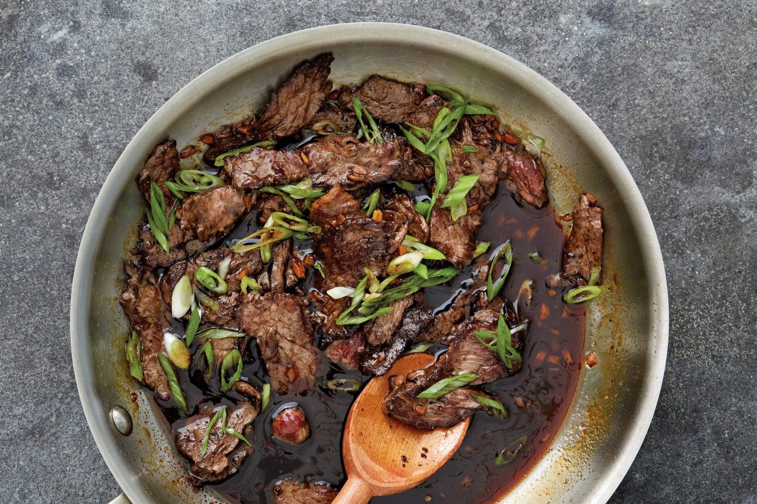 skillet of beef in saucy teriyaki sauce