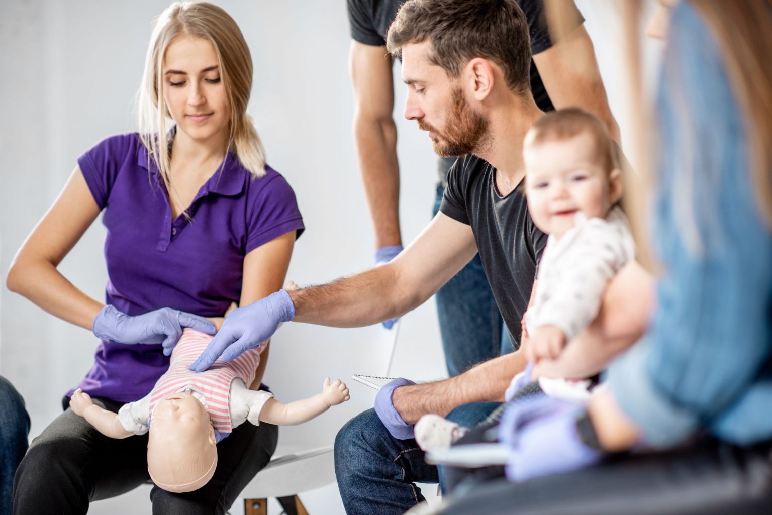 parents learning CPR