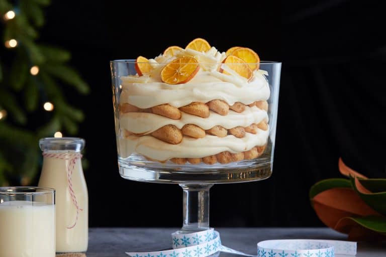 glass pedestal bowl filled with tiramisu