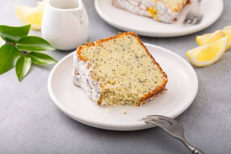 slice of glazed lemon poppy seed loaf in a white plate