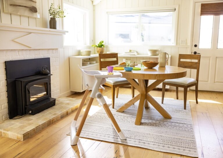 a dining table and chairs in a room