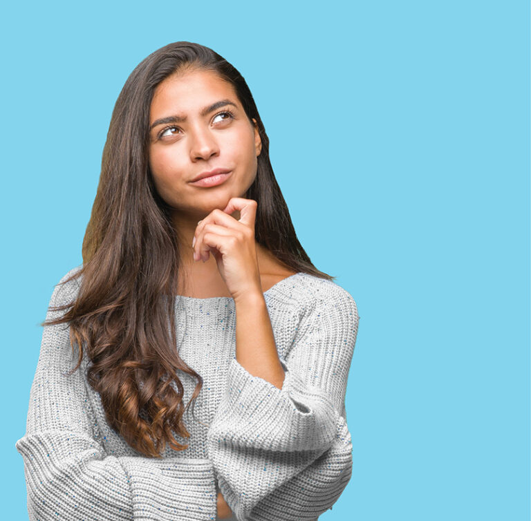 a woman with her hand on her chin