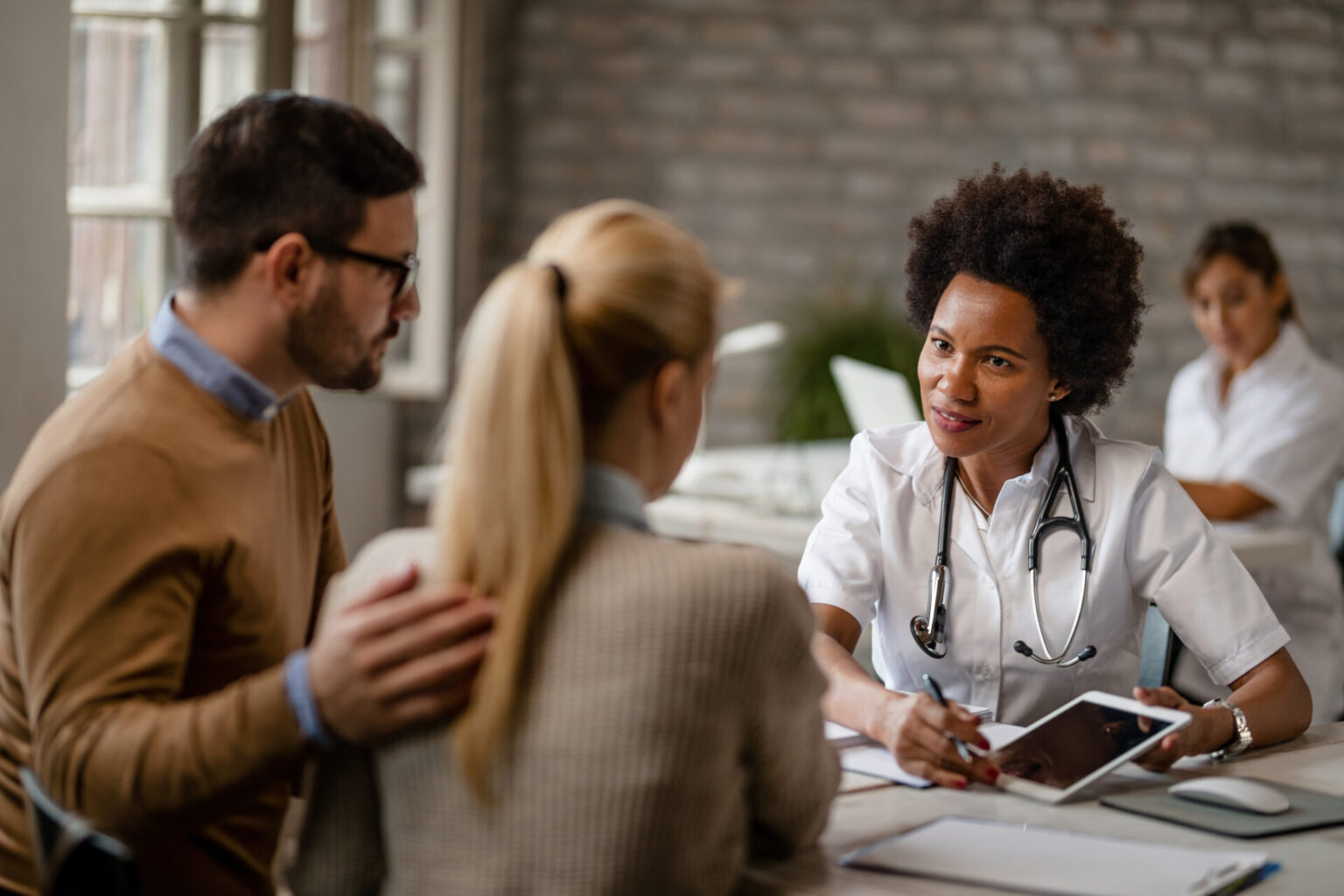 Couple speaking to Black doctor to debunk myths about fertility treatment