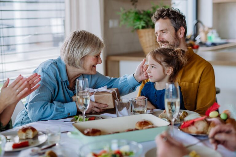 family dinner with a grandma, father and child.