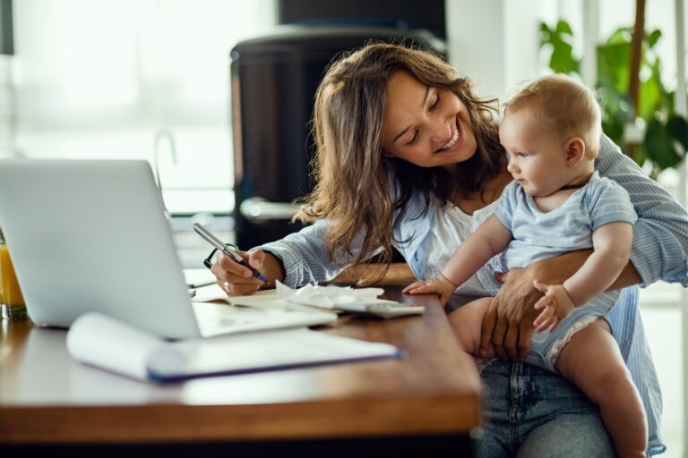 a woman holding a baby