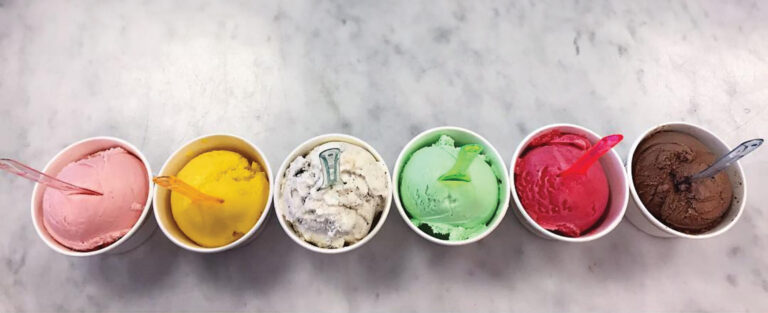 Pink, yellow, white, green, red and brown ice creams in cups from a hidden gem in Toronto, Beaches n' Cream.