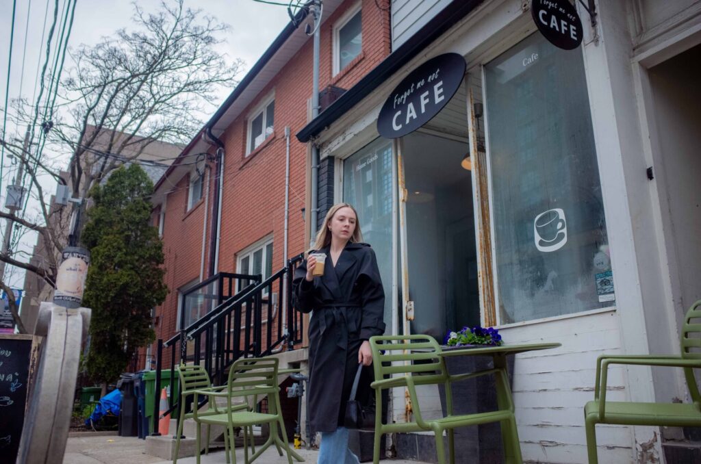 woman in front of coffee shop