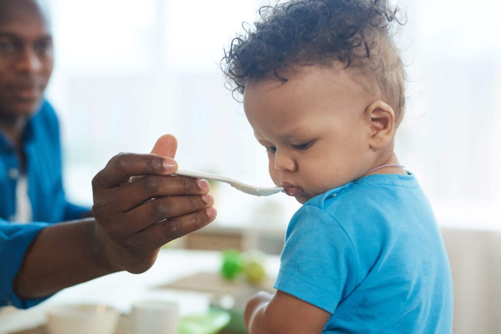 Toddler eating solid foods