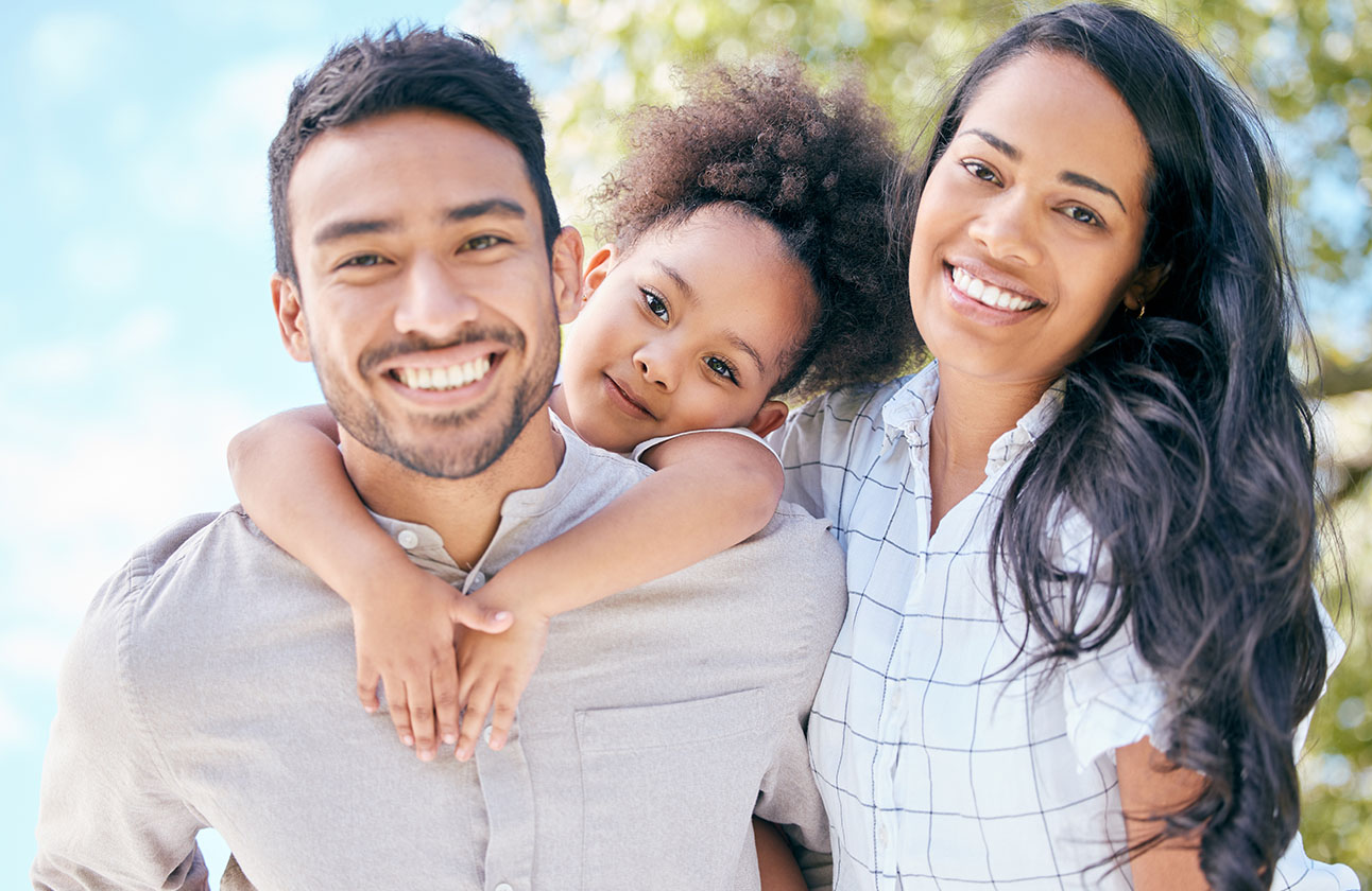 Shot of a young couple and their adorable daughter spending time together outdoors