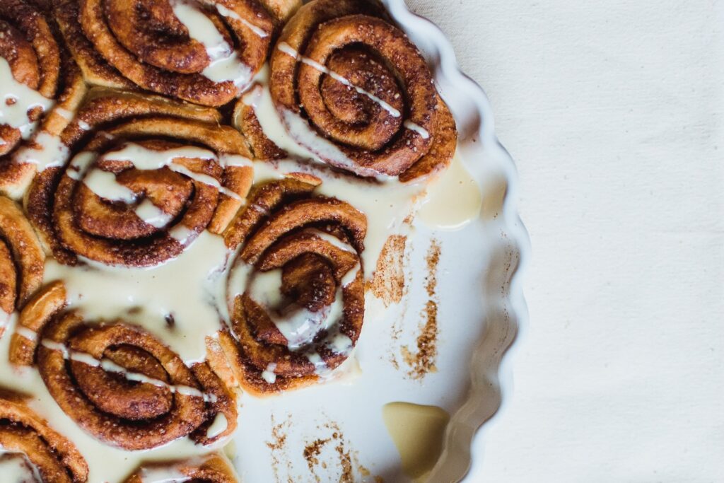 plate of cinnamon buns with a vanilla glaze