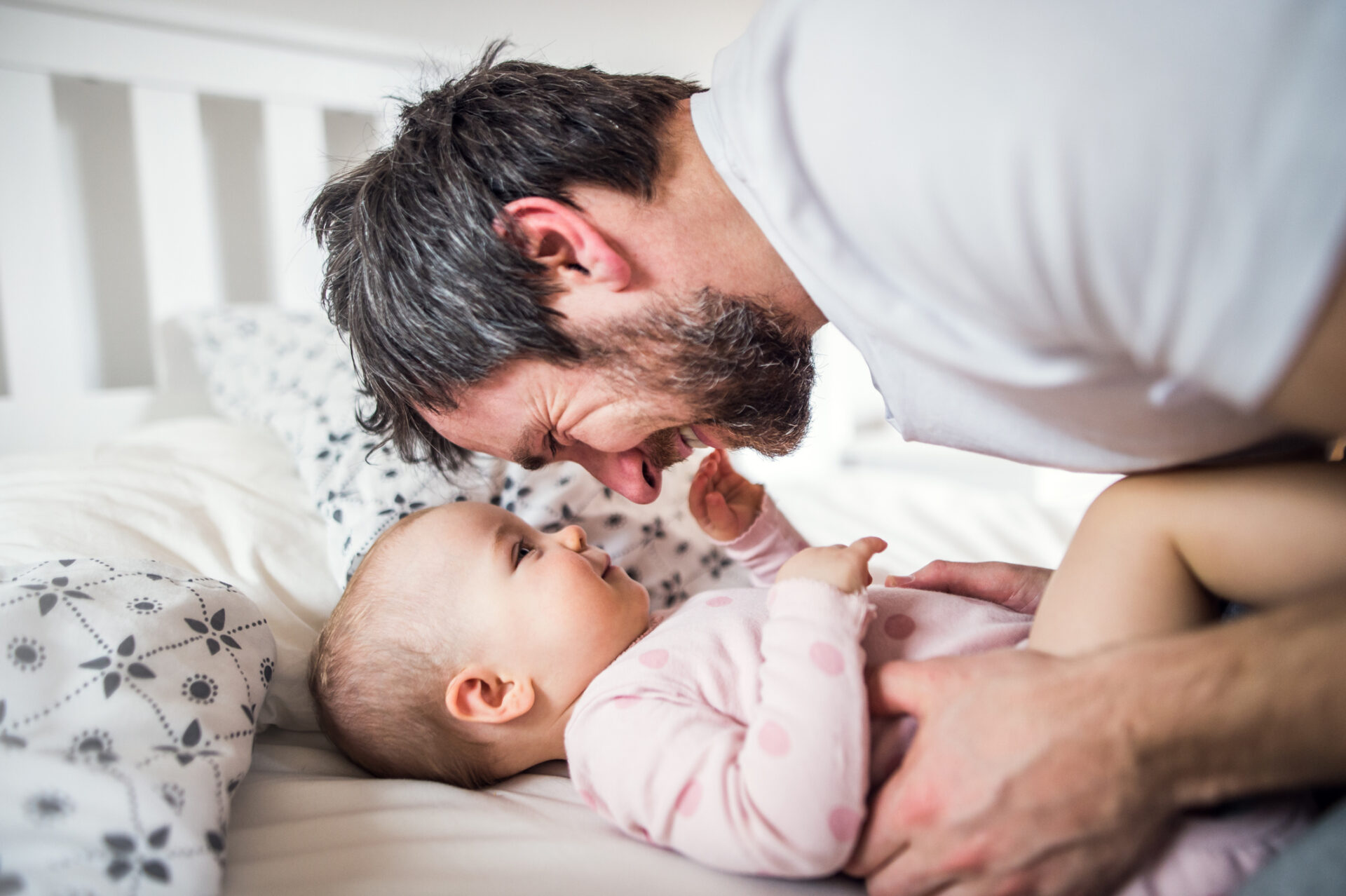 Father and infant to illustrate the benefits of taking paternity leave